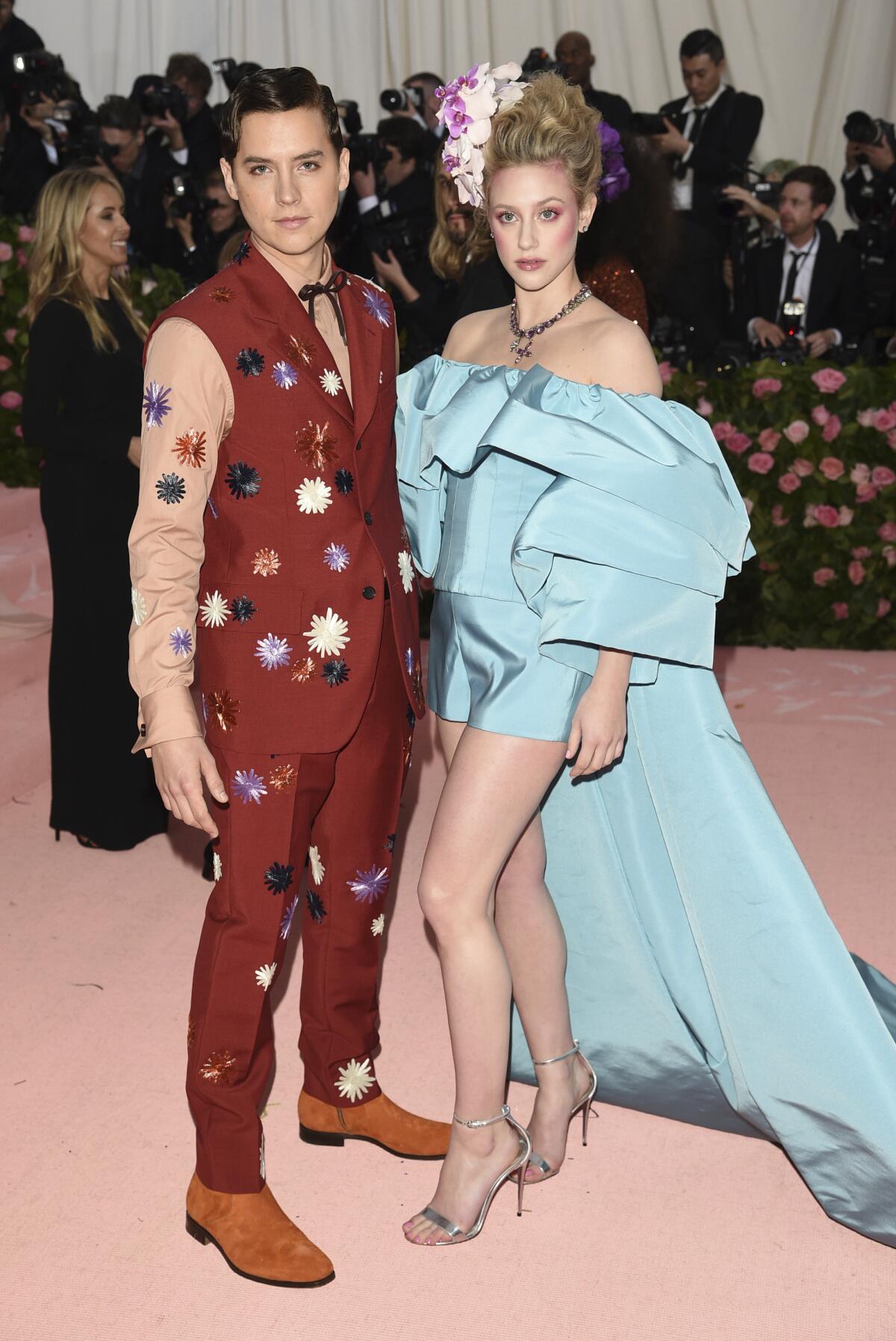 Cole Sprouse and Lili Reinhart walk the red carpet together at the 2019 Met Gala.