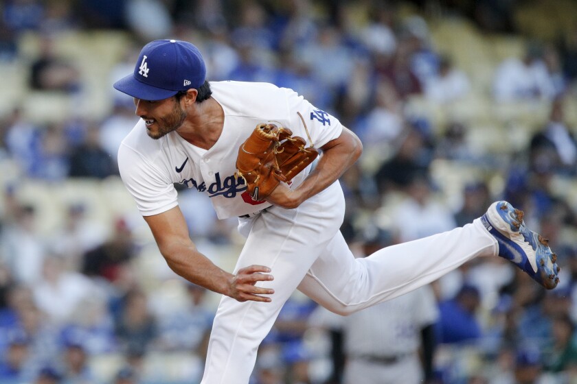Dodgers pitcher Mitch White pitches to Colorado Rockies' Kris Bryant.