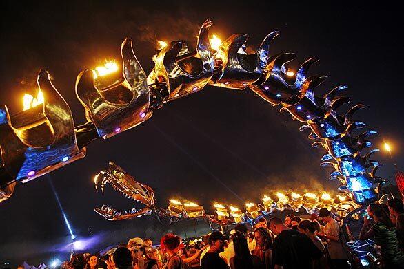 The Flaming Lotus Girls' Serpent Mother, aglow in the night at the Coachella Valley Music and Arts Festival. The structure was large enough to require a visit from the local fire marshal.