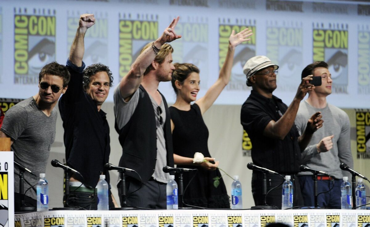 Actors Jeremy Renner, from left, Mark Ruffalo, Chris Hemsworth, Cobie Smulders, Samuel L. Jackson and Chris Evans stand during the Marvel panel at Comic-Con International on Saturday, July 26, 2014, in San Diego. (Photo by Chris Pizzello/Invision/AP)