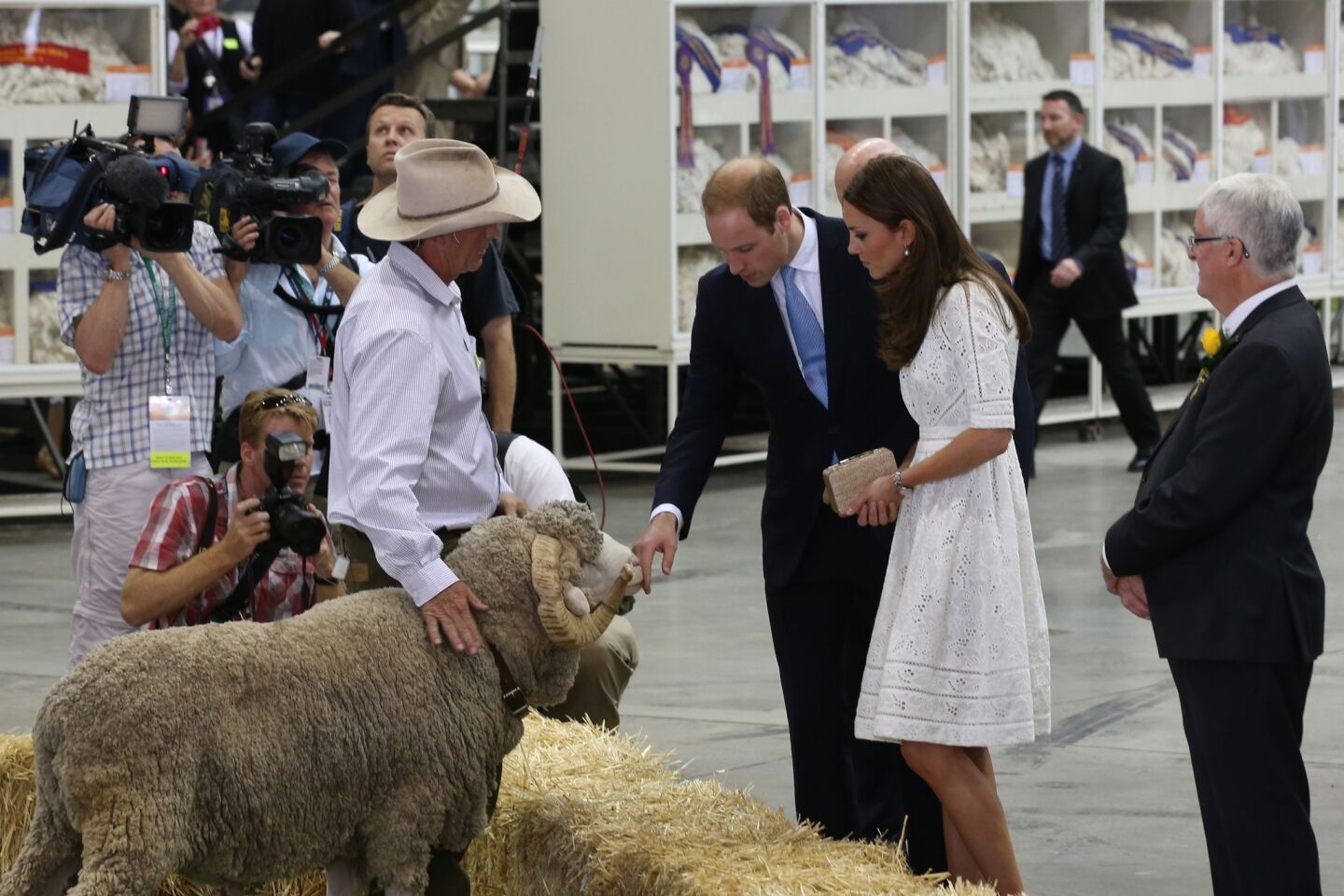 Prince William, center, and his wife, Kate, duchess of Cambridge, are introduced to Fred the Ram during a tour of a sheep and wool exhibition at the Sydney Easter Show.