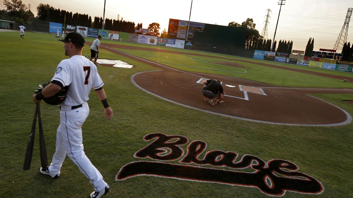 Blaze infielder Justin Seager heads to the dugout before the start of a California League game against the Stockton Ports.