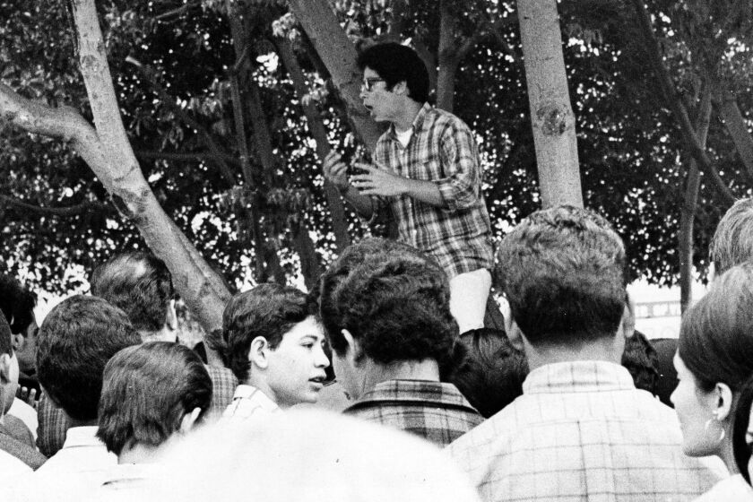John Ortiz, Mexican-American student leader at James A. Garfield High School, addressing assembled students during a walkout. Photo dated: March 7, 1968. (H.O. McCarthy / Herald-Examiner Collection / Los Angeles Public Library