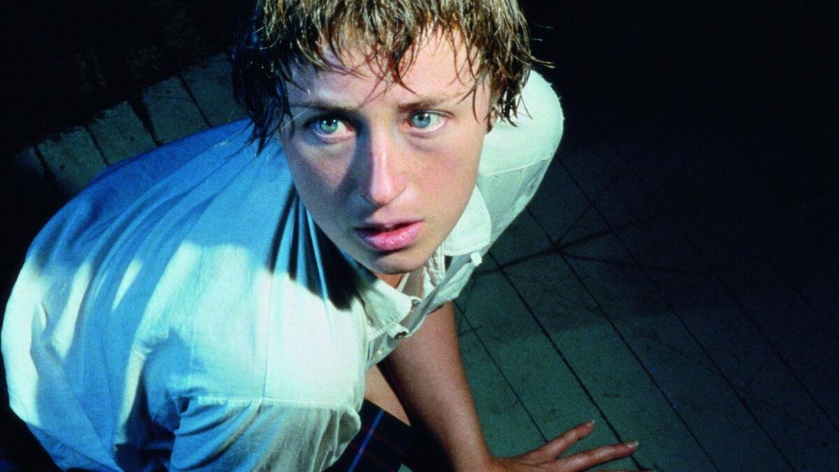 Cindy Sherman's horizontal "Untitled #92 (detail)," 1981, crosses the exploitation format of a skin-magazine centerfold with a movie screen to redirect the pop culture cliche of "woman in peril." (The Broad)