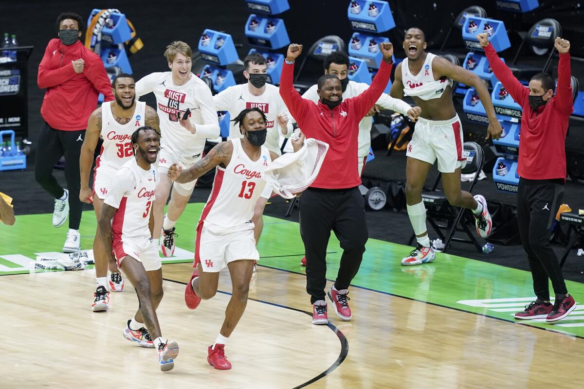 Houston players celebrate after beating Rutgers in the second round of the NCAA tournament on Sunday.
