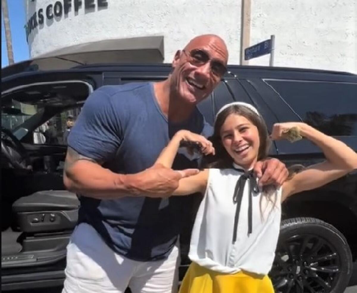 Dwayne Johnson stopped his SUV on an L.A. street Aug. 21. to buy lollipops for charity from Ever Matson, 13, of Del Mar.