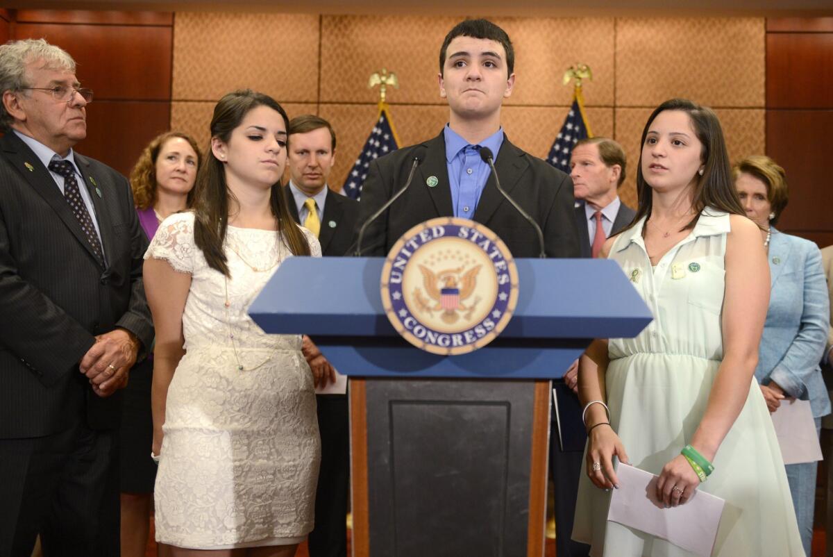In the six months since the tragedy at Sandy Hook Elementary School in Newtown, Conn., six states have strengthened firearms laws and in New Jersey and California, pending legislation seeks to tighten the regulation of assault weapons. Above: Carlos Soto, center, with his sisters Carley, left, and Jillian, right, visited Capitol Hill in Washington, D.C., to remember their slain sister Victoria Soto who was a teacher at Sandy Hook.