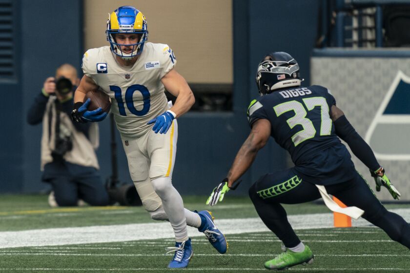 Los Angeles Rams wide receiver Cooper Kupp runs with the ball during the first half of an NFL football game against the Seattle Seahawks, Sunday, Dec. 27, 2020, in Seattle. The Seahawks won 20-9. (AP Photo/Stephen Brashear)