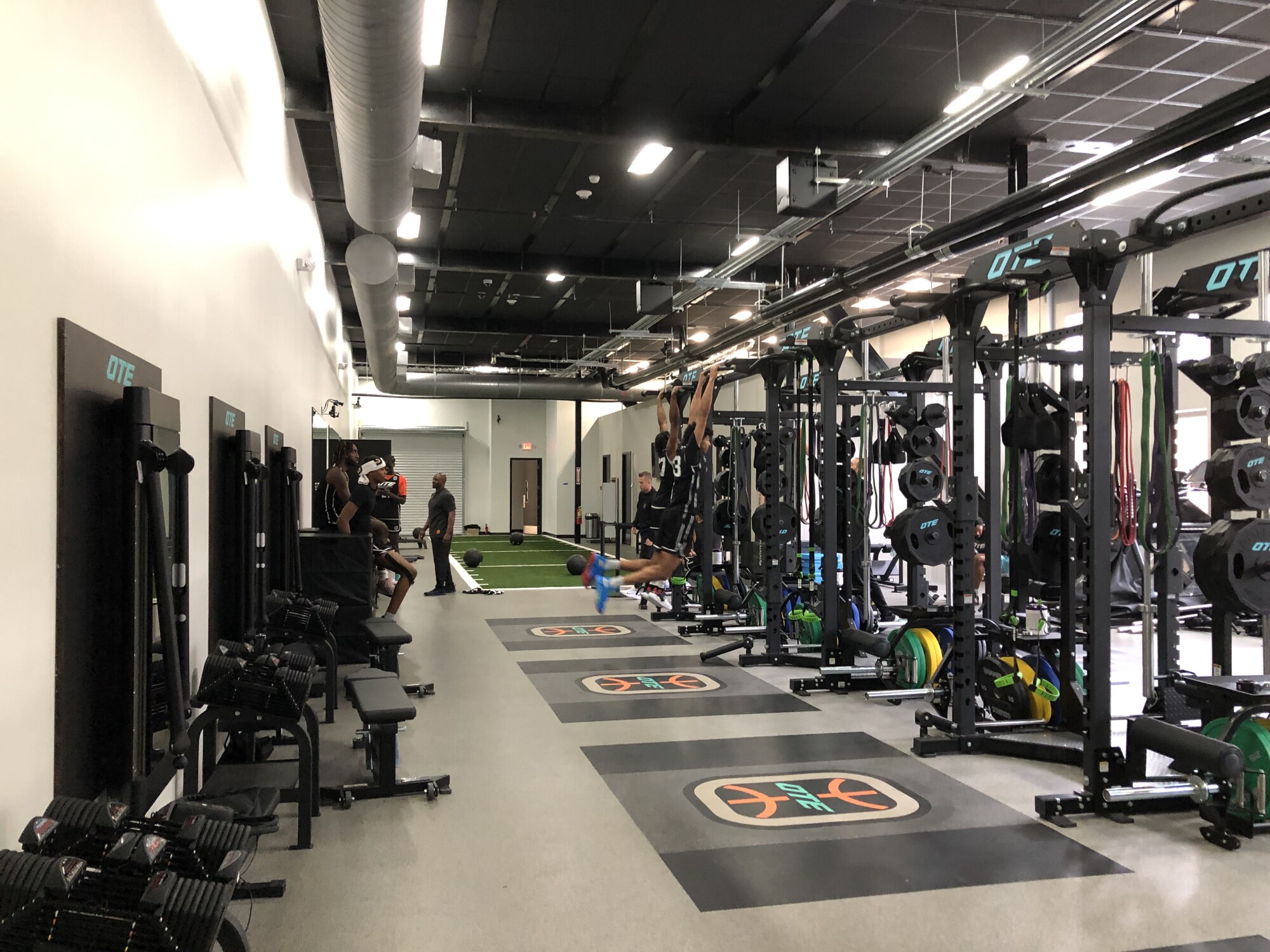 Overtime Elite basketball players use an NBA-style weight room on campus in Atlanta.