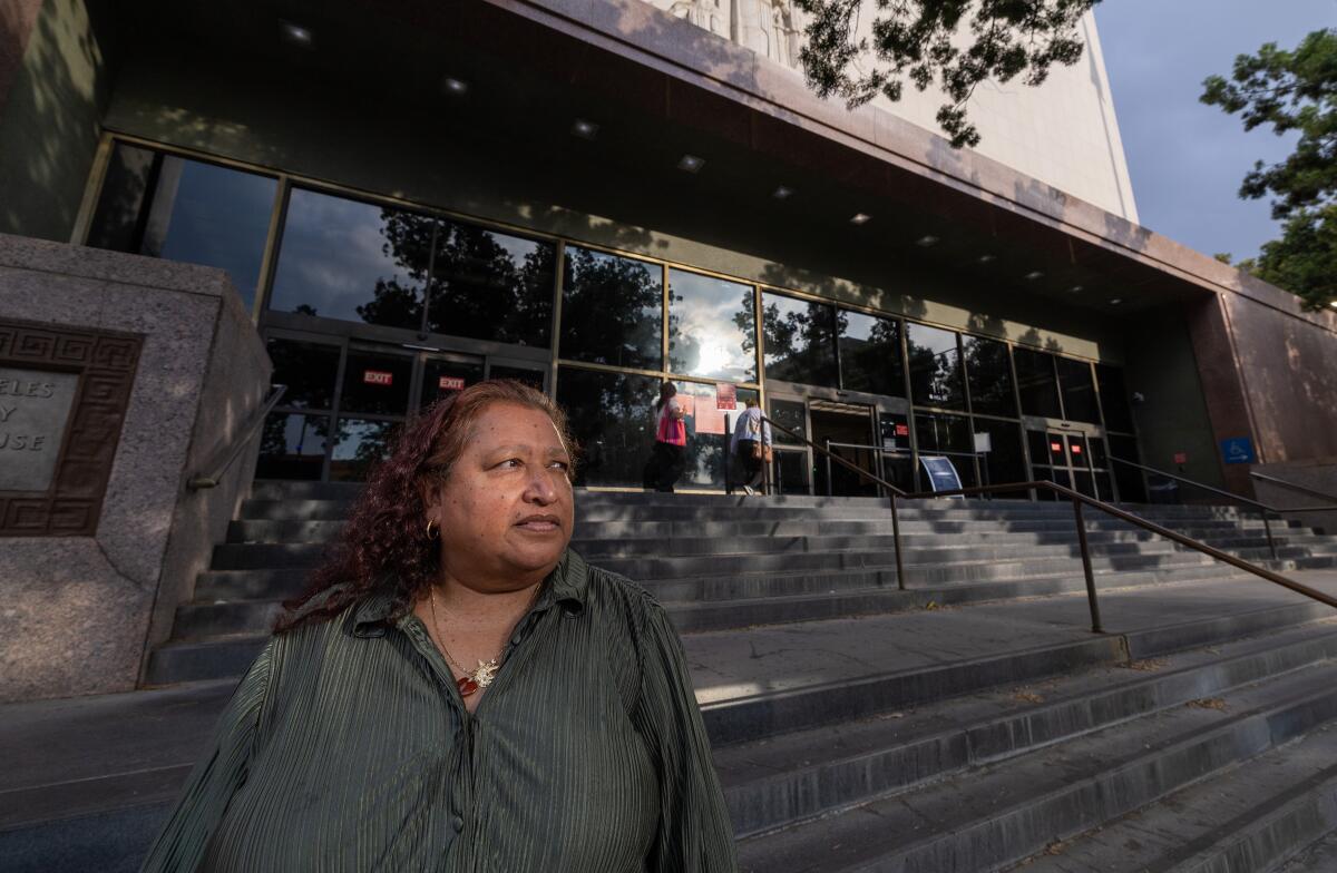 Alcira Ayala stands outside the Stanley Mosk Courthouse 