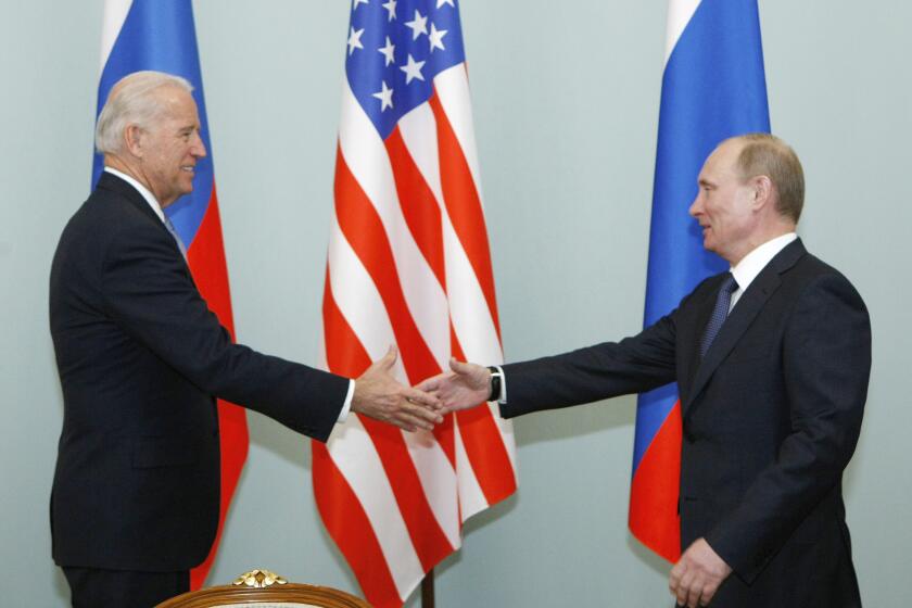 FILE - In this March 10, 2011, file photo, then Vice President Joe Biden, left, shakes hands with Russian Prime Minister Vladimir Putin in Moscow, Russia. President Joe Biden will hold a summit with Vladimir Putin next month in Geneva, a face-to-face meeting between the two leaders that comes amid escalating tensions between the U.S. and Russia in the first months of the Biden administration. (AP Photo/Alexander Zemlianichenko, File)