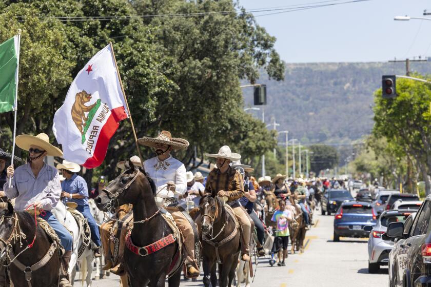 Whittier, CA- Participants of the Gran Cabalgata, marching on the streets of Whittier as they head towards South El Monte as part of a rally to defend their rights, land, culture and traditions.