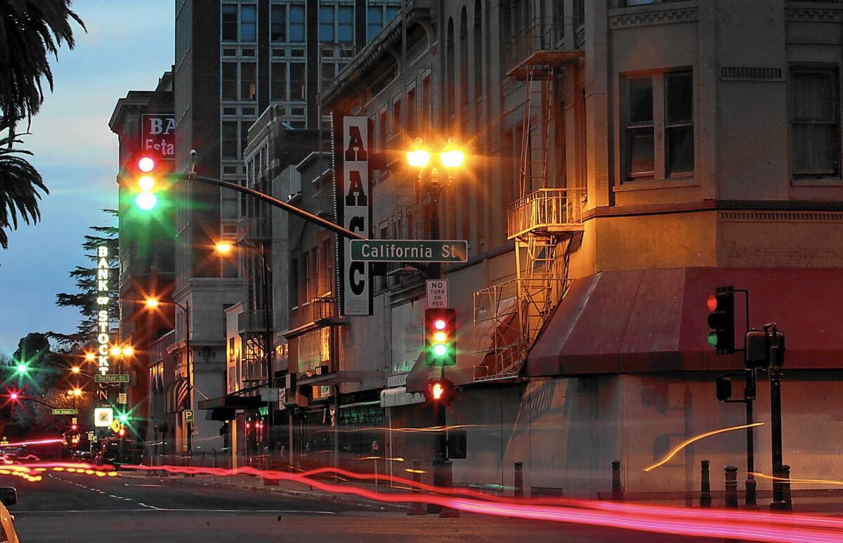 Stockton's bankruptcy plan slashes city spending, cuts salaries and eliminates jobs — but preserves worker pensions. Above, downtown Stockton after dark.