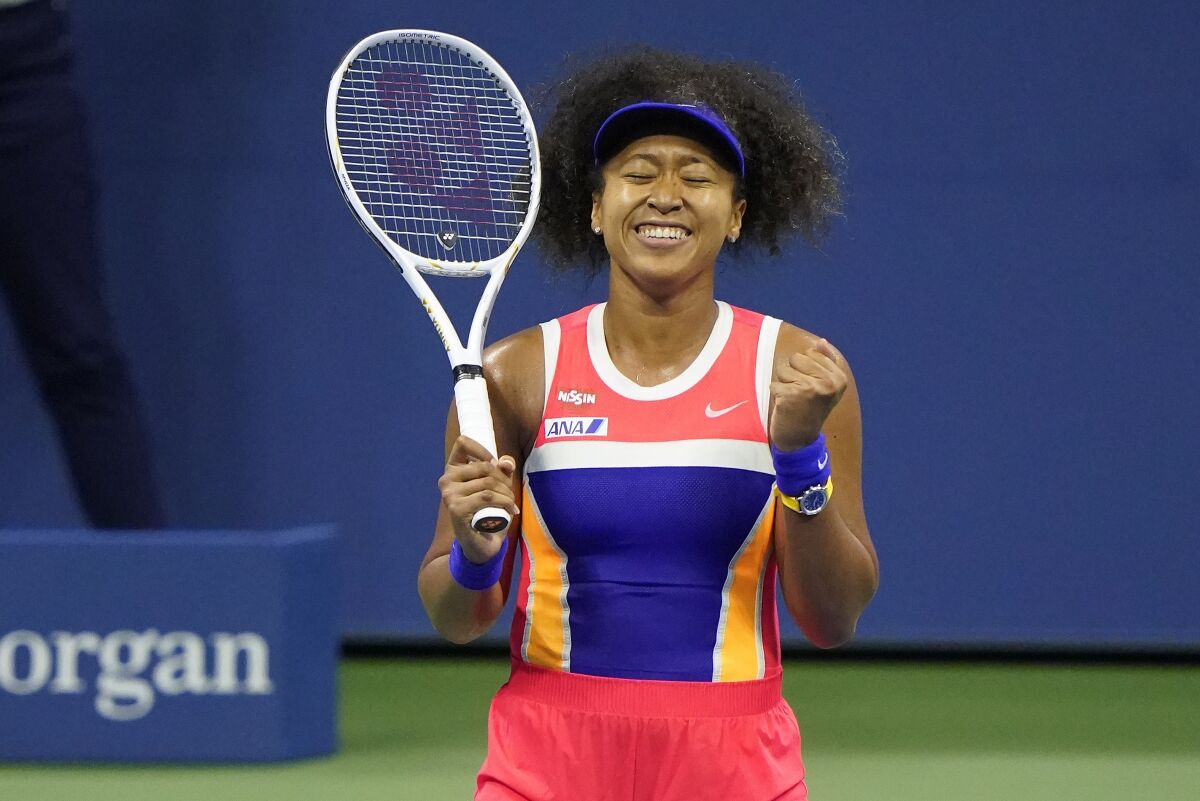 Naomi Osaka reacts dduring a match
