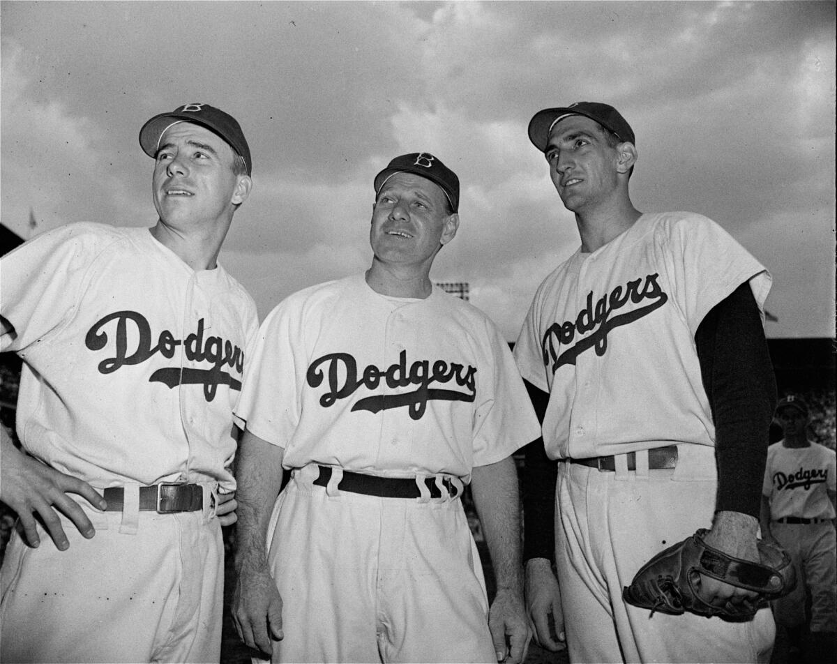 Pee Wee Reese, left, Leo Durocher, center, and Ralph Branca in 1948.