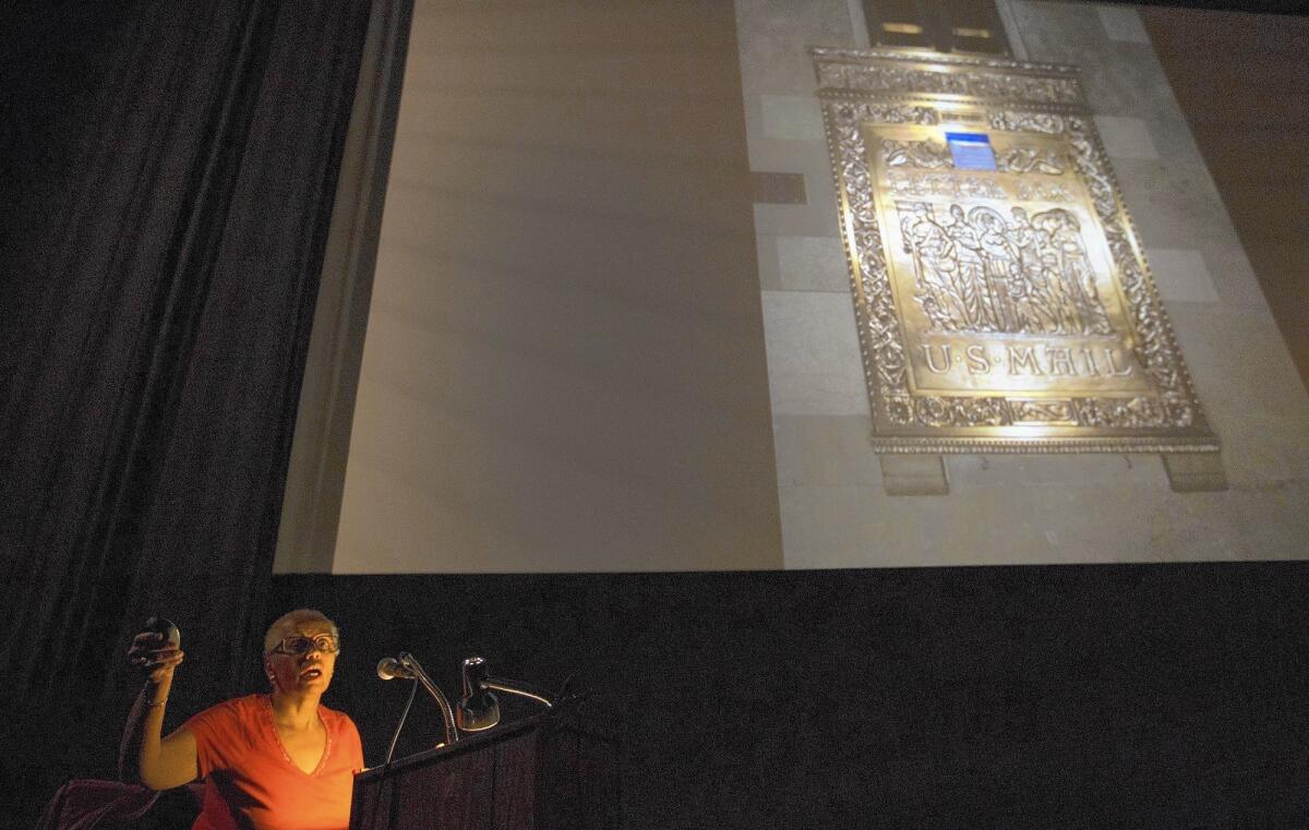 Author Karen Greene shows slides of Art Deco mailboxes during her lecture at the Egyptian Theatre in Hollywood.