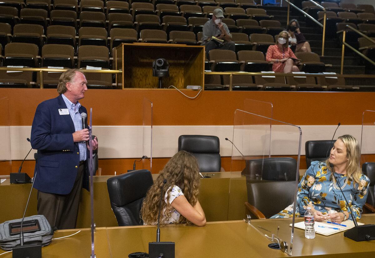 Huntington Beach City Councilman Mike Posey asks a question during a meeting of the Orange County Power Authority.  