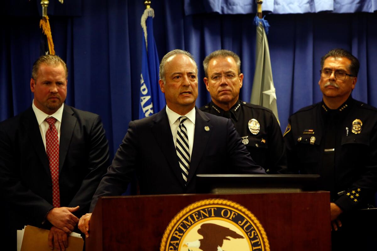 U.S. Atty. Nicola T. Hanna speaks at a news conference in downtown L.A. announcing the arrest of Mark Steven Domingo.