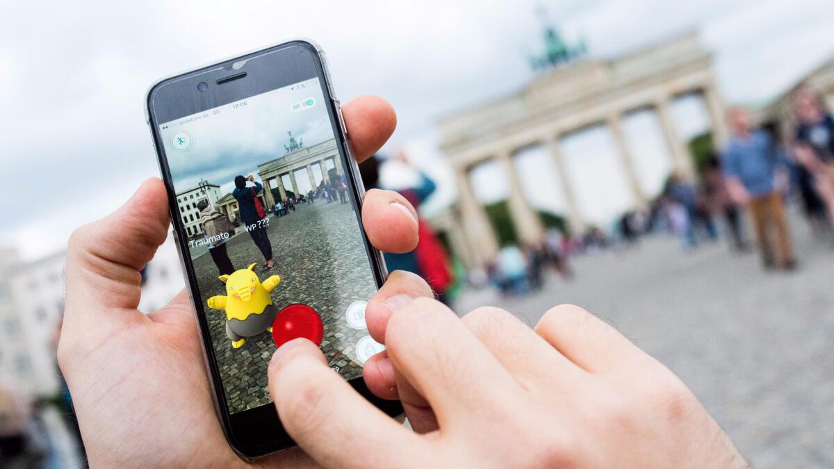 While gamers play "Pokemon Go" in countries where it's been released -- here a man plays near Berlin's Brandenburg Gate -- Chinese have been finding innovative ways to get their hands on the game.
