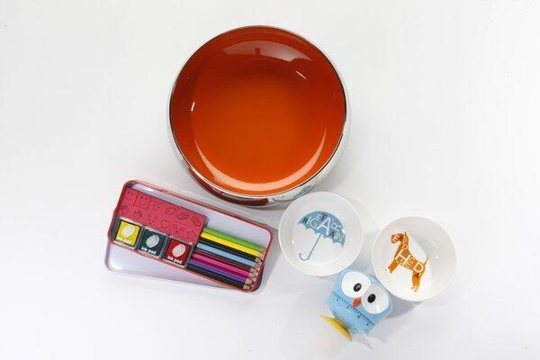 JCPenney also has a playful new Royal Doulton collection that includes stainless steel serving bowls with pops of color inside. The 9-inch-diameter orange bowl shown here was $40. The same collection includes ceramic plates and bowls with punchy graphics, including the 4.25-inch-diameter "Every Dog Has Its Day" and "Right As Rain" candy bowls pictured here, $25 for a set of two. JCPenney also has a Museum of Modern Art mini shop, where we found an owl kitchen timer from hip housewares designer Kikkerland, $15, as well as an old-school fingerprint art set so we can channel Ed Emberley, $12.