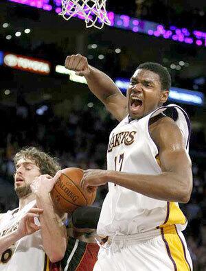 Lakers center Andrew Bynum reacts after his offensive-rebound basket put the Lakers aheadof Miami, 104-102, late in the fourth quarter Sunday.