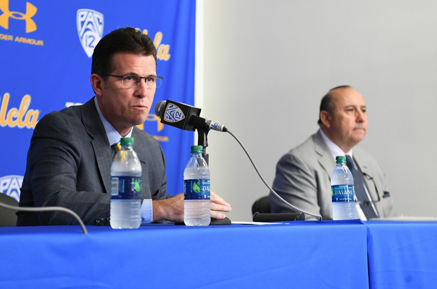 UCLA basketball head coach Steve Alford announces all three players are suspended during a news conference at Pauley Pavilion. At right is Dan Guerrero, athletic director.