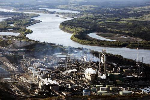 Suncor Energy refineries and pipeline terminals rest alongside the Athabasca River, where the company mines for oil sands in Alberta, Canada. Alberta's oil sands -- a wild, Florida-sized region where moose, bear and beaver inhabit watery woodlands -- yield 1 million barrels of oil a day and harbor more proven reserves than anyplace on earth except Saudi Arabia.