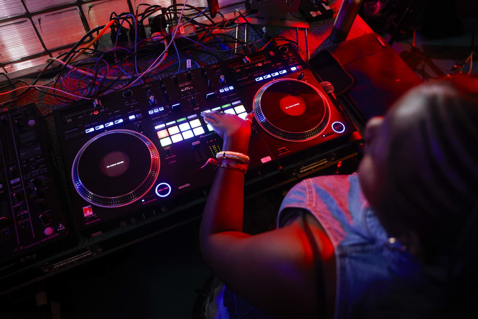 Festivalgoers dance while Kailyn Brown performs during her DJ set at at Coachella