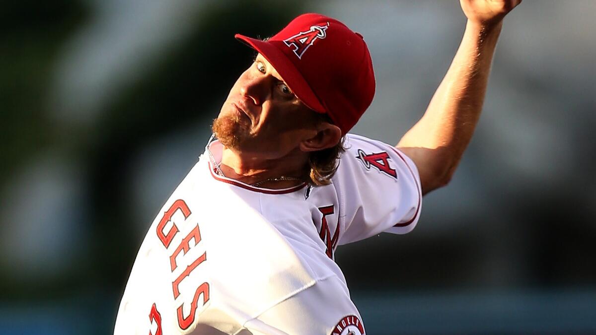 Angels starter Jered Weaver delivers a pitch during the team's 7-1 loss to the Oakland Athletics on Wednesday.
