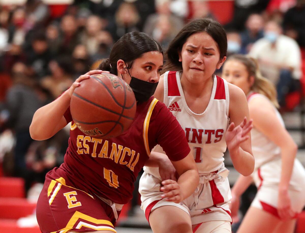 Estancia's Mackenzie Sanchez drives to the basket against Santa Ana on Wednesday night.