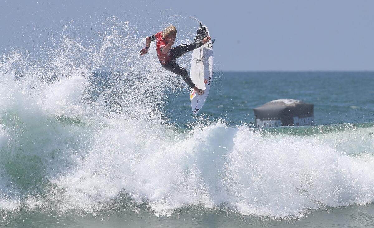 Jarvis Earle of Austrailia goes off the top of a big wave as he advances on Friday.