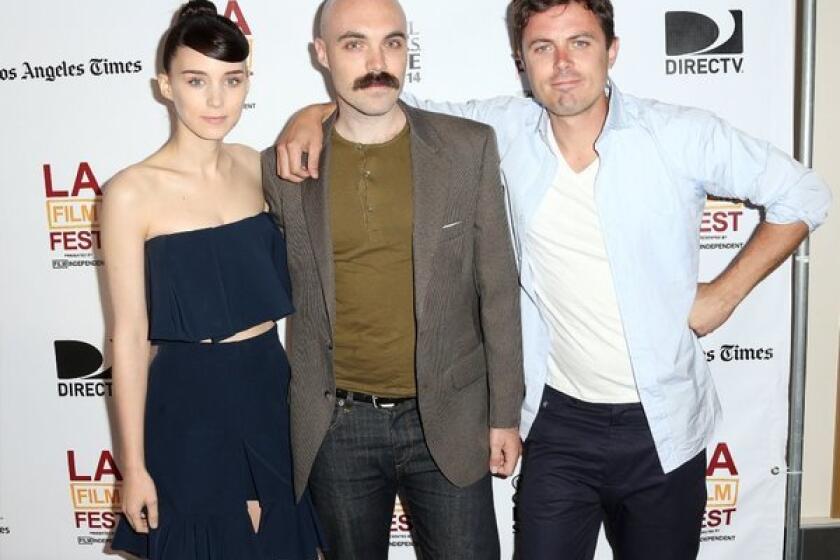Actress Rooney Mara, writer-director David Lowery, center, and actor Casey Affleck attend a screening of "Ain't Them Bodies Saints" at the Los Angeles Film Festival.