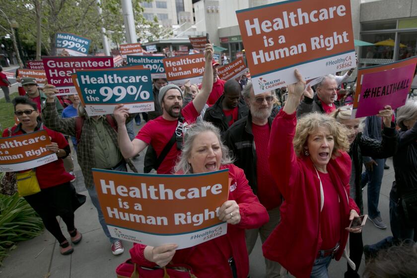 FILE--In this April 26, 2017, file photo, supporters of single-payer health care march to the Capitol in Sacramento, Calif. State experts say a California bill that would provide government-funded health coverage for everyone in the state would cost $400 billion and require significant tax increases. (AP Photo/Rich Pedroncelli, file)