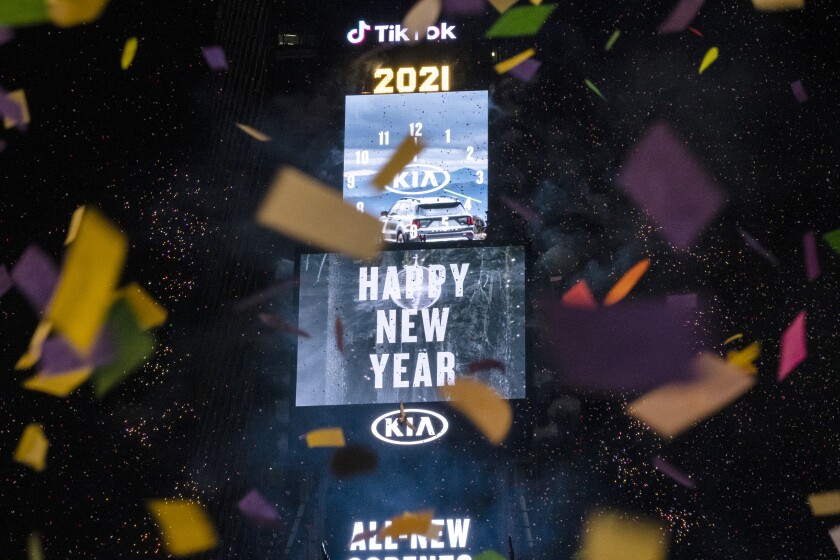 Confetti flies after the Times Square New Year's Eve Ball drops in a nearly empty Times Square, late Thursday, early Friday, Jan. 1, 2021, in New York, as the area normally packed with revelers remained closed off to due to the ongoing coronavirus pandemic. (AP Photo/Craig Ruttle)