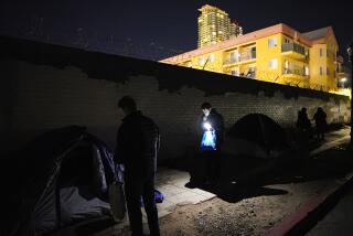 San Diego, CA - January 26: Working in the East Village, Scott Manning (l) and Jesus Montes (r) were among the volunteers working on Thursday, Jan. 26, 2023 before sunrise in San Diego, CA., for the annual point-in-time count taking place in San Diego County. (Nelvin C. Cepeda / The San Diego Union-Tribune)