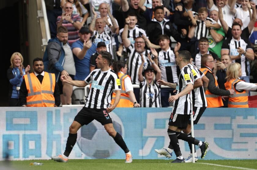 Newcastle United's Fabian Schar celebrates scoring their side's first goal of the game during the English Premier League soccer match between Newcastle United and Nottingham Forest, at St. James' Park in Newcastle, England, Saturday, Aug. 6, 2022. (Richard Sellers/PA via AP)