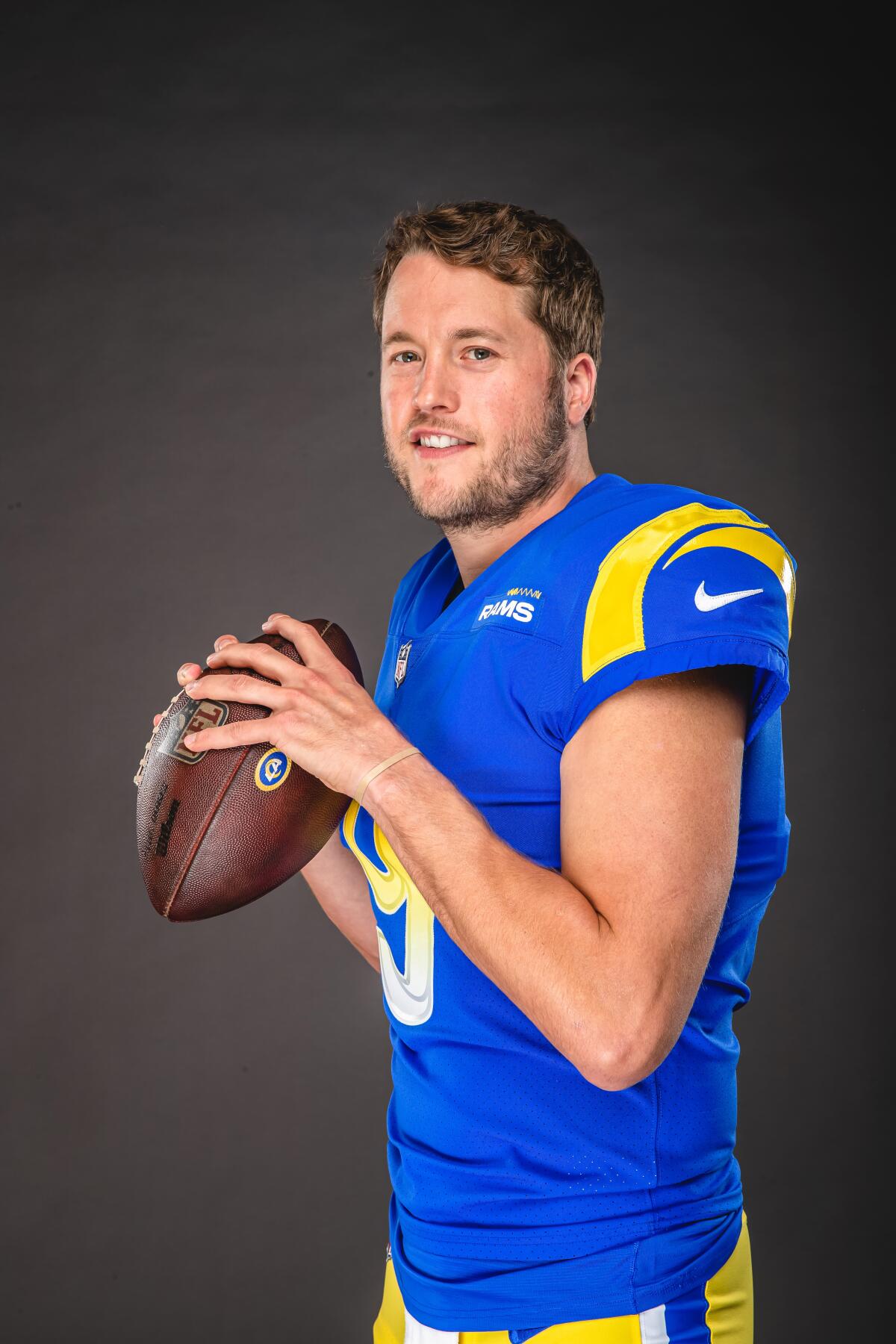 Los Angeles Rams quarterback Matthew Stafford (9) poses in his new uniform.