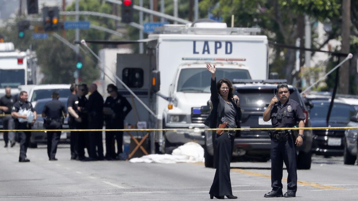 An LAPD command post is set up near the scene of the officer-involved shooting at Central Avenue and 42nd Street in South Los Angeles.