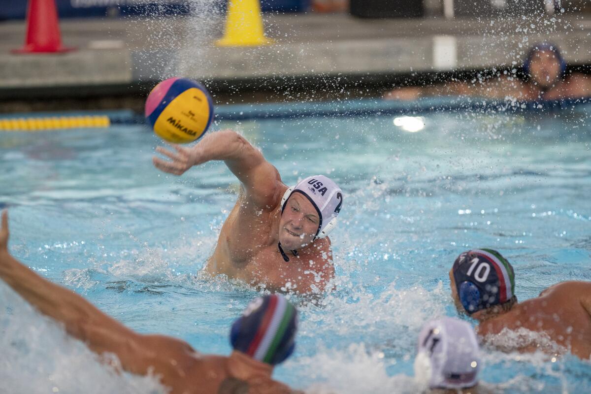 Chase Dodd takes a shot and scores during an exhibition game against Italy at Irvine's Woollett Aquatics Center on Tuesday.