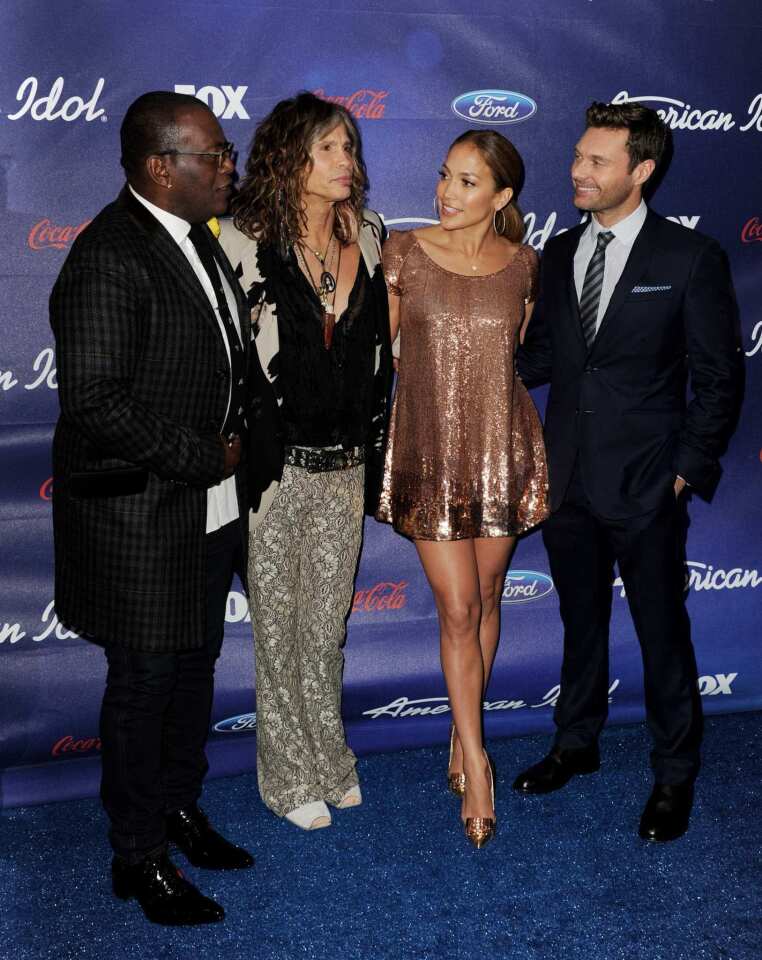 "American Idol Season 11" hit a milestone moment Thursday night with the debut of Season 11's top 13 contestants. The judges -- from left, Randy Jackson, Steven Tyler and Jennifer Lopez -- along with host Ryan Seacrest were on hand at the Grove in Los Angeles for the celebration.