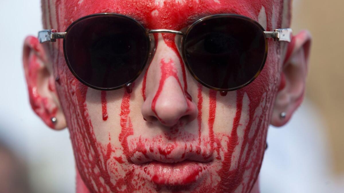 WASHINGTON: A young man covered his head in fake blood for Saturday's March for Our Lives.