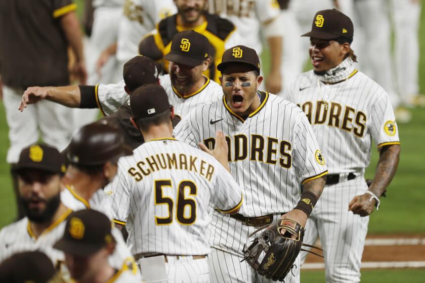 Manny Machado of the San Diego Padres celebrates after beating the St. Louis Cardinals 4-0 to win the Wild Card Series at Petco Park on Friday, Oct. 2, 2020. (K.C. Alfred / The San Diego Union-Tribune)