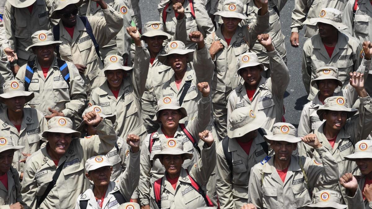 Members of Venezuela's Bolivarian Militia attend a pro-government rally on May 1, 2019, in Caracas.