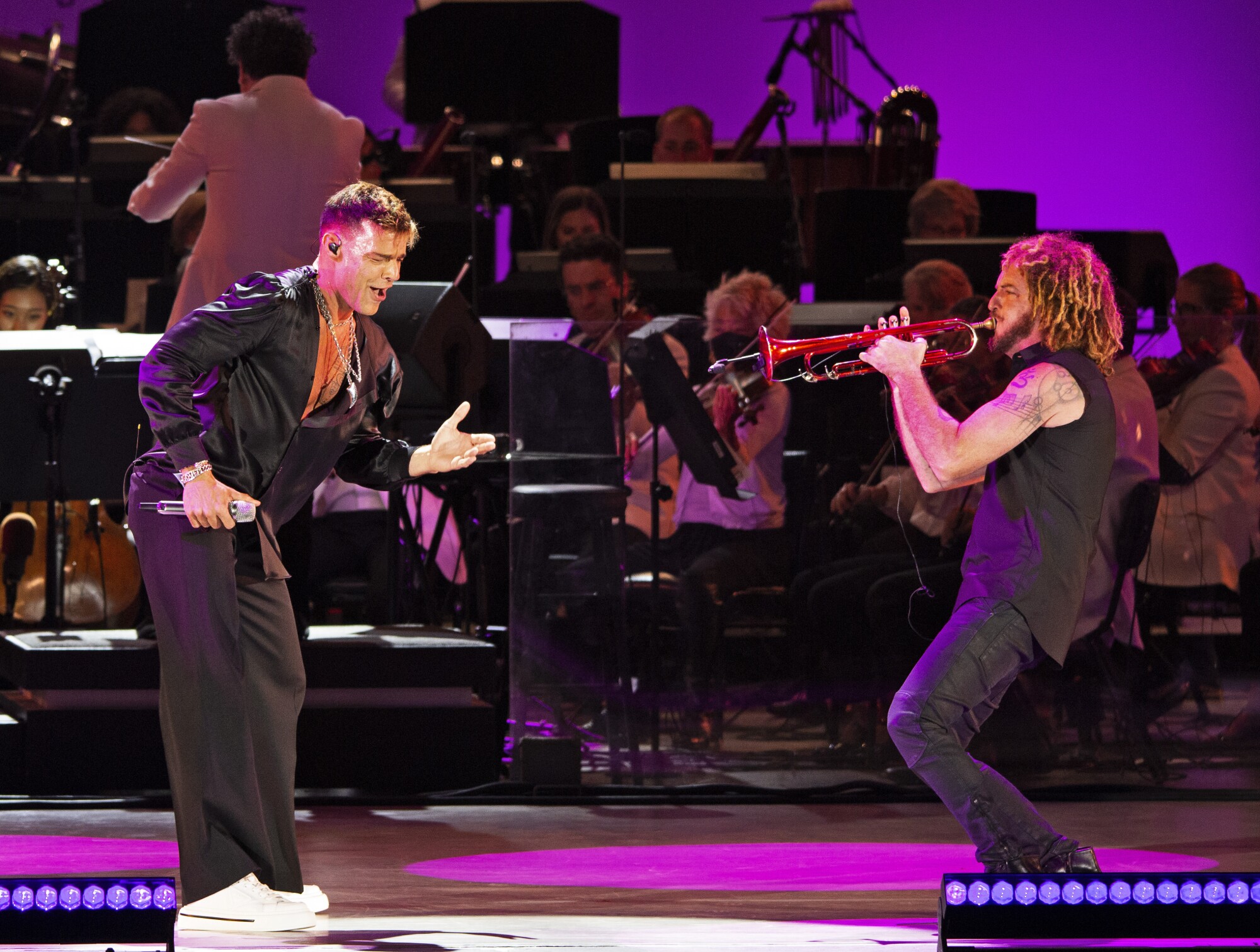 Ricky Martin, left, performs at the Hollywood Bowl