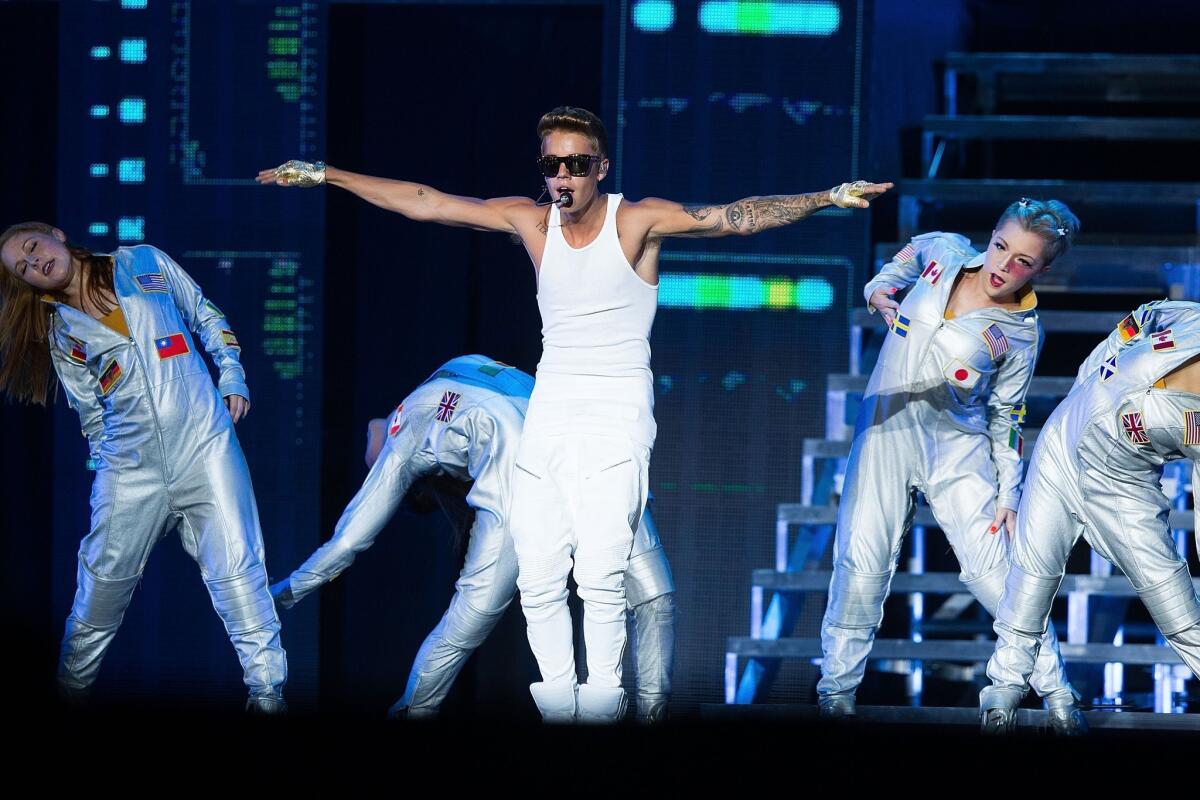 Fans of Justin Bieber, shown performing in Singapore, may have an easier time getting tickets to California shows under a bill signed Monday by Gov. Jerry Brown.