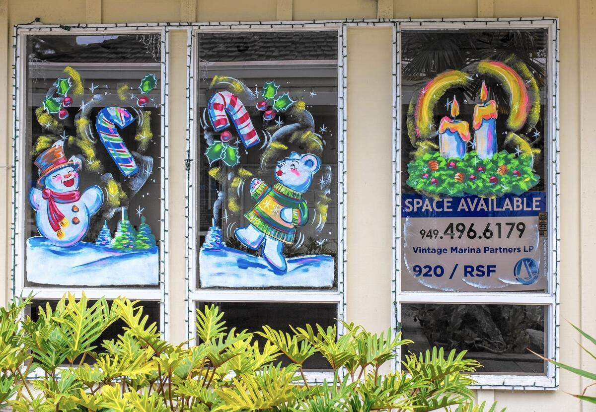 Despite vacant stores over the holidays, building owners in the Dana Point Harbor put up decorations to help keep the mood festive.