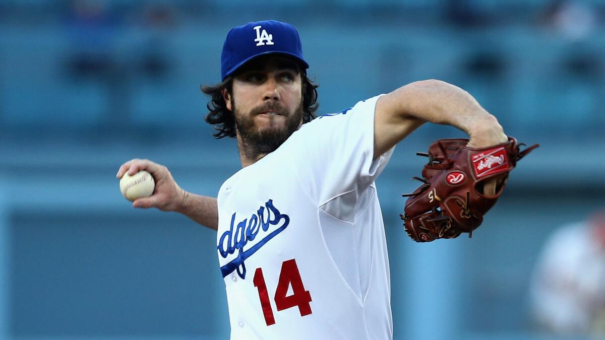 Dodgers starter Dan Haren delivers a pitch during the first inning of the team's 8-2 loss to the Chicago Cubs at Dodger Stadium on Friday.