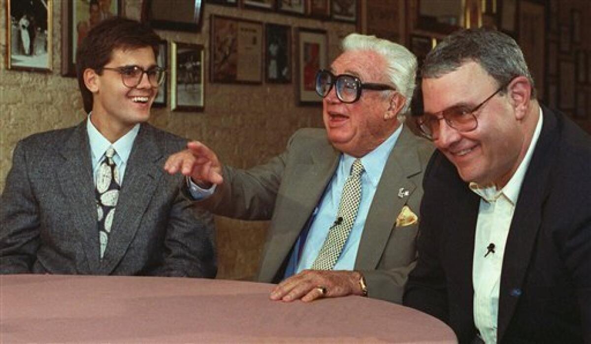 In this May 13, 1991 file photo, Hall of Fame baseball announcer Harry Caray, center, with his son Skip, right, and grandson Chip, pose together in Chicago. The three generations were to broadcast the Cubs and Atlanta Braves game that night. The Atlanta Braves say longtime broadcaster Skip Caray has died in his home at 68, Sunday, August 3, 2008. (AP Photo/John Zich, File)