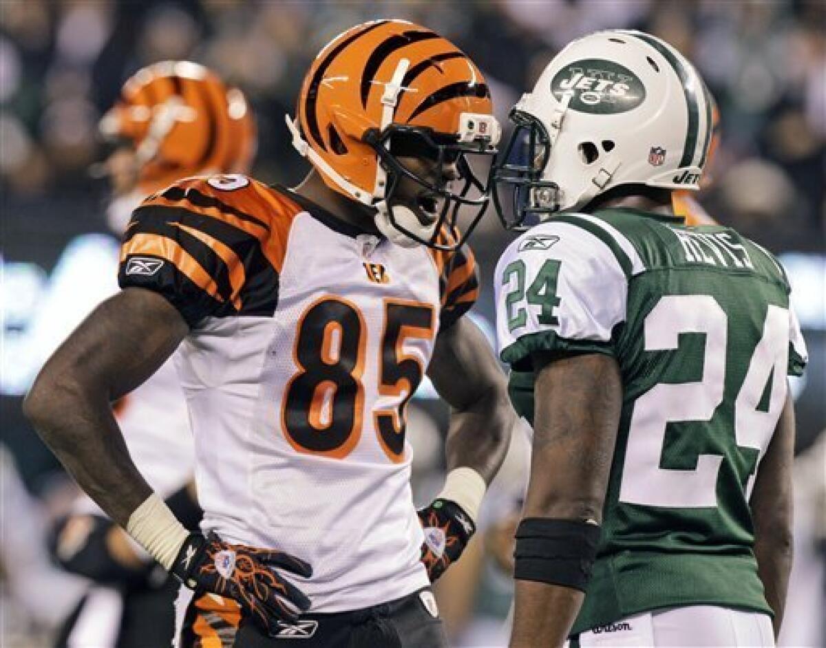 Cincinnati Bengals quarterback Carson Palmer (9) is sacked by New York Jets  linebacker Calvin Pace (97) and linebacker Jason Taylor (99) during the  fourth quarter of an NFL football game between the