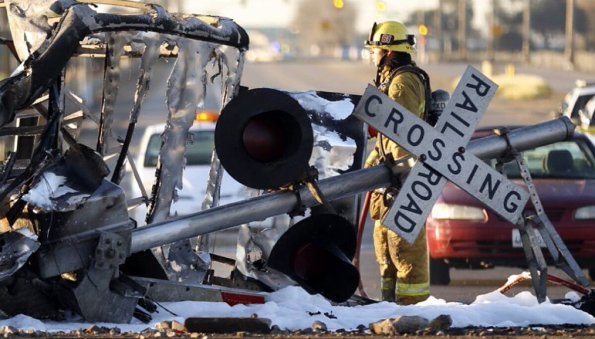 A firefighter stands in the intersection where a Metrolink train collided with a truck near Oxnard on Feb. 24, 2015.